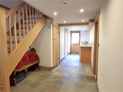 REAR HALLWAY AND UTILITY AREA
